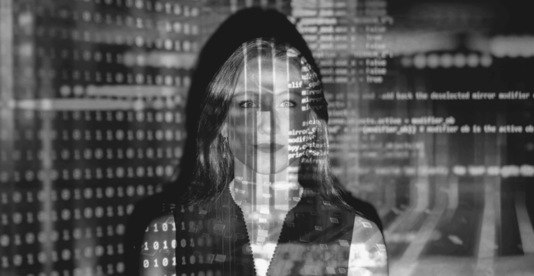 This image of a woman overwritten by code illustrates our discussion topic: Agentic AI, the relevance of autonomous phishing for modern businesses, and how to tackle it with Digital Risk Protection.