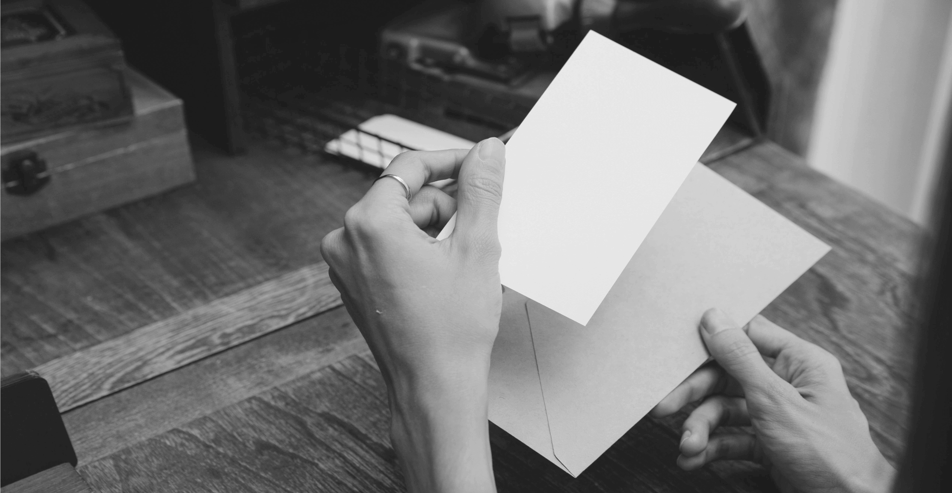 This image of someone opening a letter illustrates our discussion topicL Phishing emails in the US, and how to protect organization.