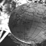 This image of a globe-shaped bauble in front of the Christmas tree illustrates our discussion topic: Christmas celebrations, and brand protection strategies, around the world.