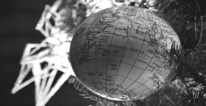 This image of a globe-shaped bauble in front of the Christmas tree illustrates our discussion topic: Christmas celebrations, and brand protection strategies, around the world.
