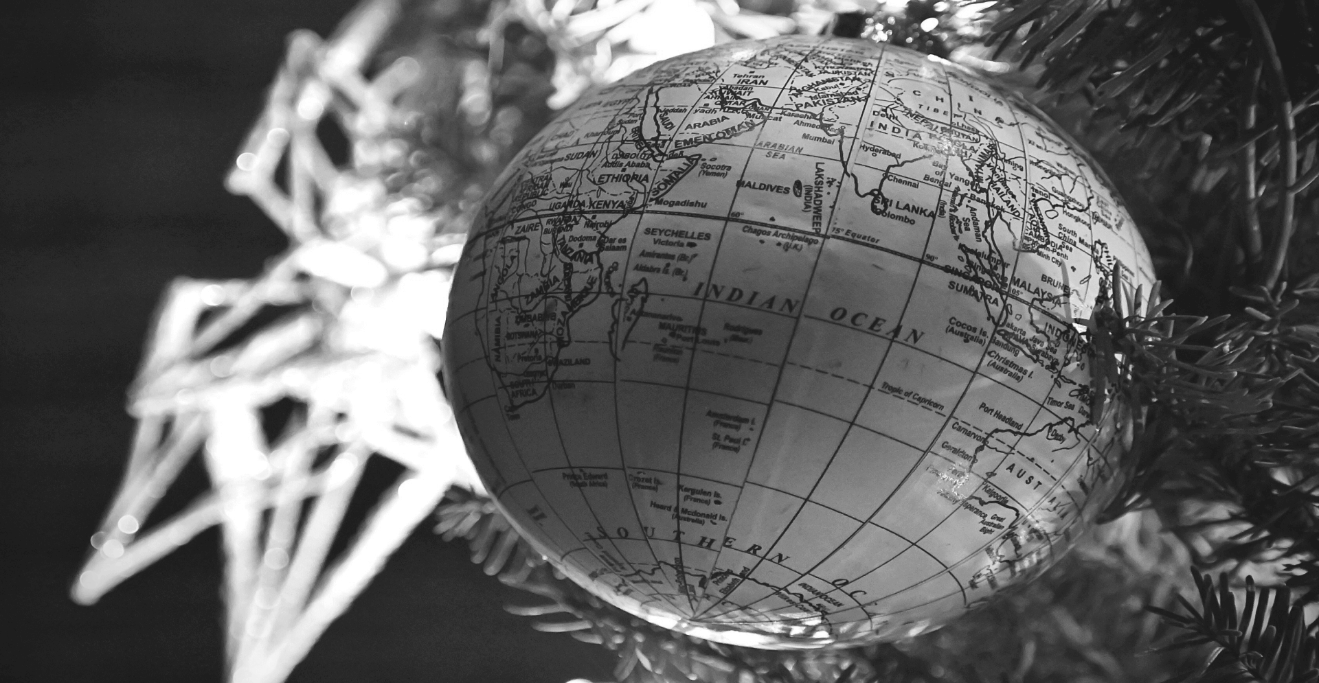 This image of a globe-shaped bauble in front of the Christmas tree illustrates our discussion topic: Christmas celebrations, and brand protection strategies, around the world.