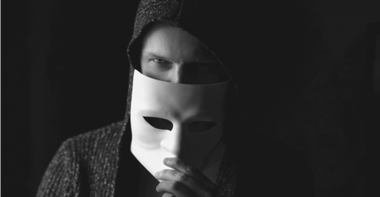 This image of a shady hooded figure in a mask illustrates our discussion topic: Darcula, the phishing as a service kit, and how understanding its nuances boosts your cybersecurity resilience.