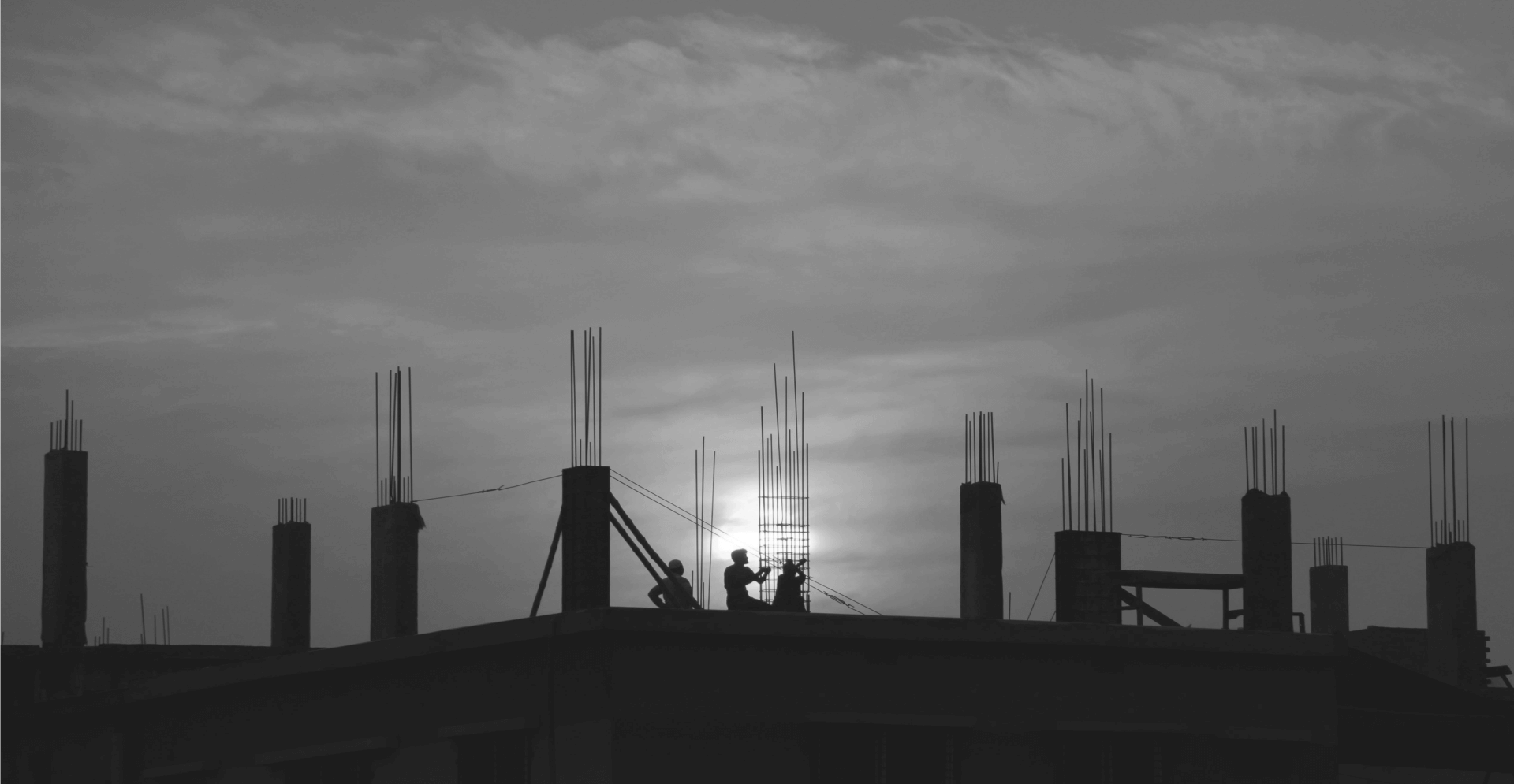 This image of two workers silhouetted on a construction site illustrates our discussion topic: Exploring the best ways to build stable, secure, forward-thinking DNS infrastructure.