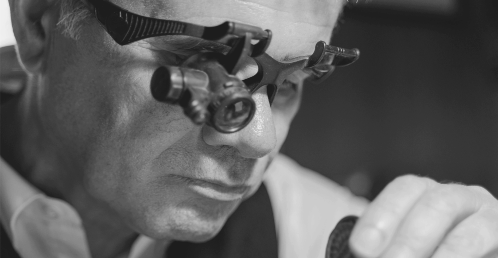 This image of a technical specialist observing a watch through a specialised lens illustrates our discussion topic: The differences between HTTP and HTTPS redirects for your website security, performance, and SEO.