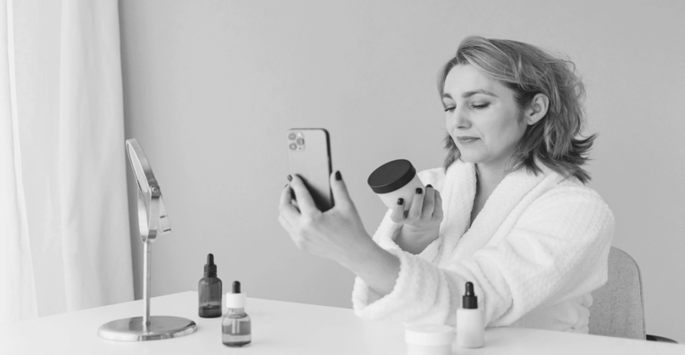 This image of an influencer trying on beauty products illustrates our discussion topic: counterfeit health products, their impact on consumers, and the role of brands in fighting back.