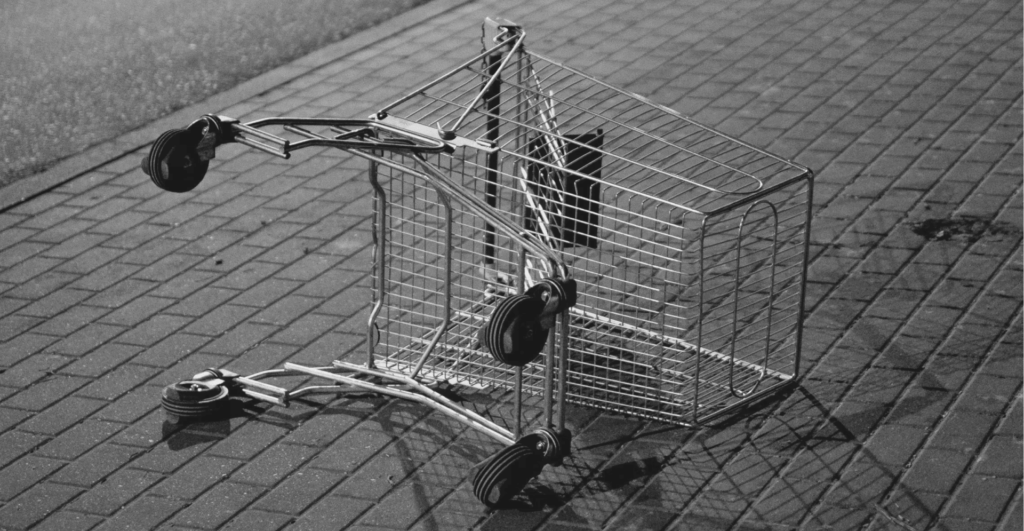 This image of a tipped over shopping cart illustrates our discussion topic: How one cyberattack illustrates the importance of digital risk protection in the retail sector.