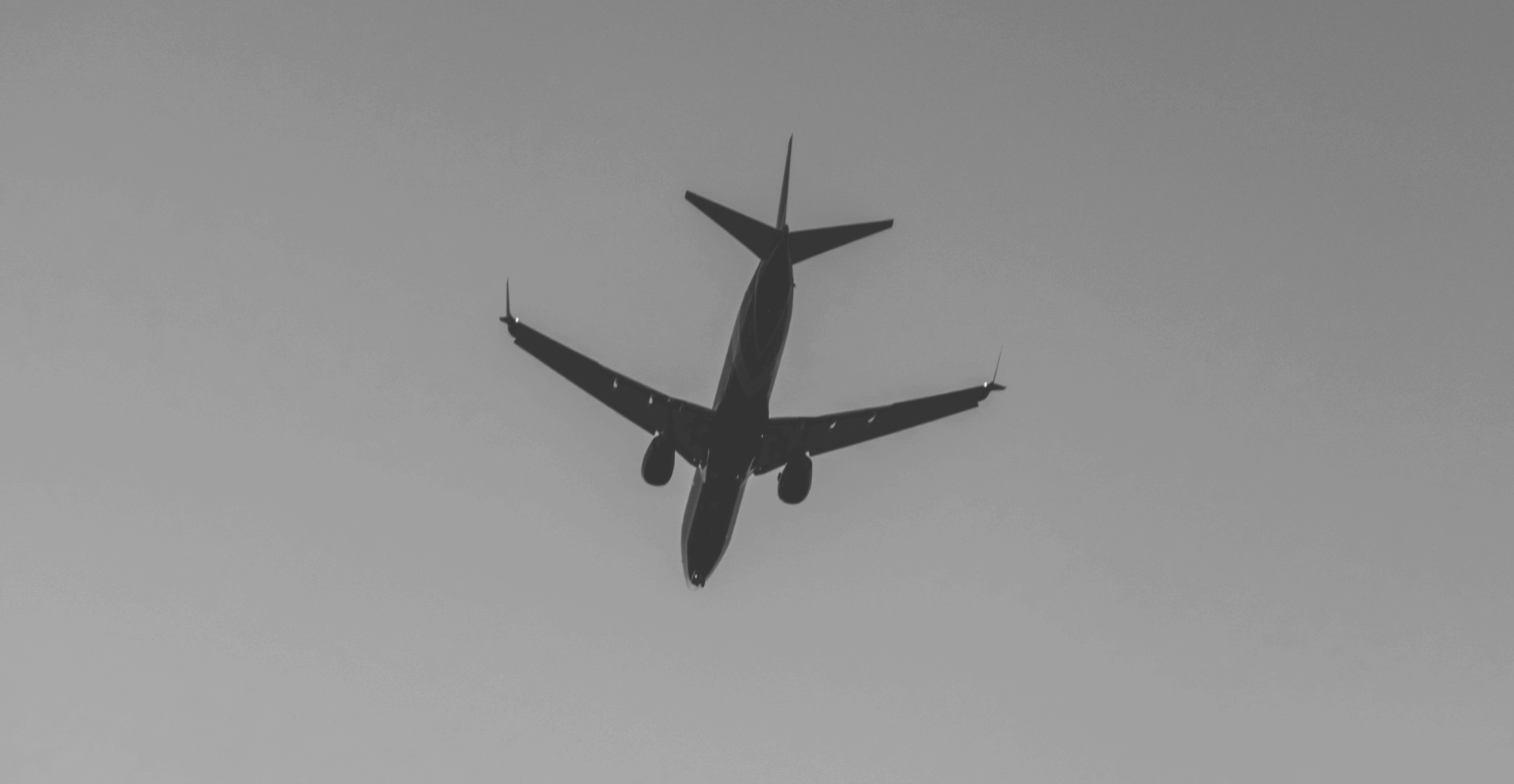 This image of a plane in the sky illustrates our discussion topic: customer service scams in the travel and services industries.